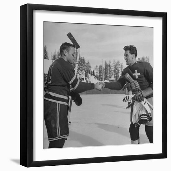 The Usa Team Giving the Swiss a Sweater and a Friendly Handshake before the Game-Mark Kauffman-Framed Premium Photographic Print