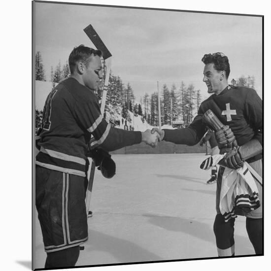 The Usa Team Giving the Swiss a Sweater and a Friendly Handshake before the Game-Mark Kauffman-Mounted Premium Photographic Print