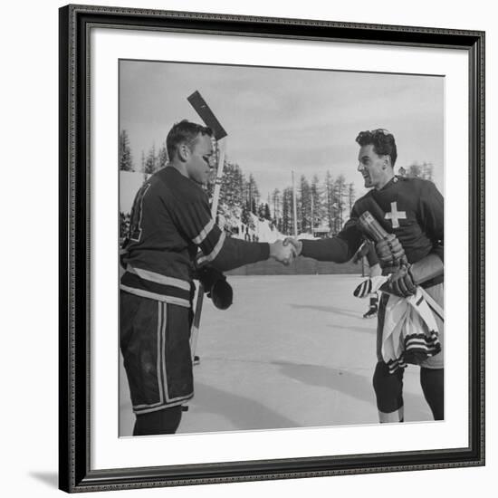 The Usa Team Giving the Swiss a Sweater and a Friendly Handshake before the Game-Mark Kauffman-Framed Premium Photographic Print