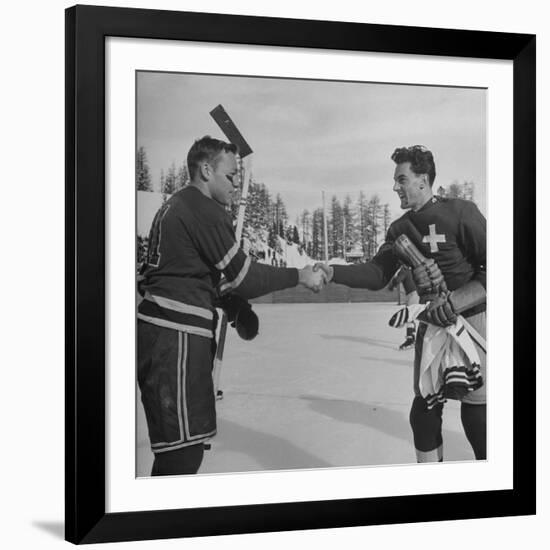 The Usa Team Giving the Swiss a Sweater and a Friendly Handshake before the Game-Mark Kauffman-Framed Premium Photographic Print