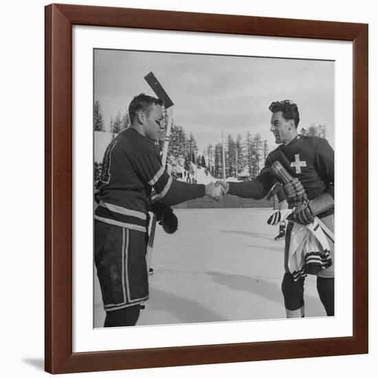 The Usa Team Giving the Swiss a Sweater and a Friendly Handshake before the Game-Mark Kauffman-Framed Premium Photographic Print