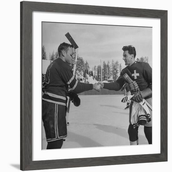 The Usa Team Giving the Swiss a Sweater and a Friendly Handshake before the Game-Mark Kauffman-Framed Premium Photographic Print