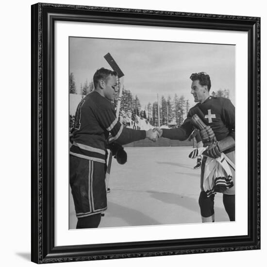 The Usa Team Giving the Swiss a Sweater and a Friendly Handshake before the Game-Mark Kauffman-Framed Premium Photographic Print