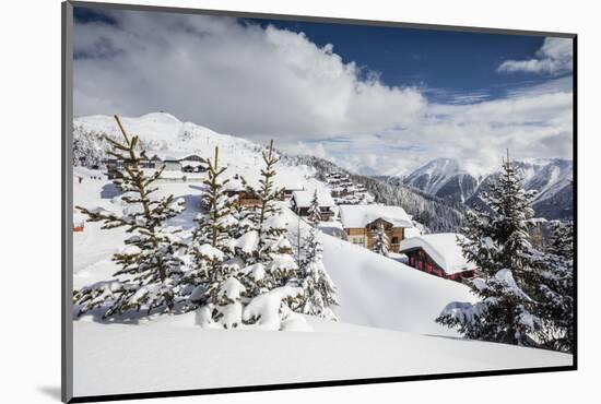 The Winter Sun Shines on the Snowy Mountain Huts and Woods, Bettmeralp, District of Raron-Roberto Moiola-Mounted Photographic Print