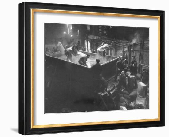 The Workmen Quickly Covering the Ingot with Vermiculite-Ralph Morse-Framed Photographic Print