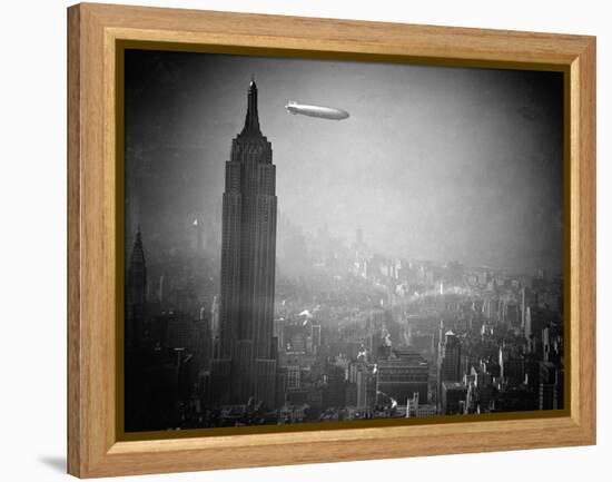 The Zeppelin Hindenburg Floats Past the Empire State Building-null-Framed Premier Image Canvas