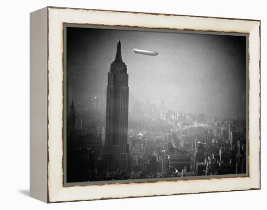 The Zeppelin Hindenburg Floats Past the Empire State Building-null-Framed Premier Image Canvas