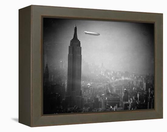 The Zeppelin Hindenburg Floats Past the Empire State Building-null-Framed Premier Image Canvas