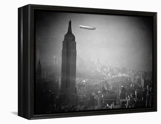 The Zeppelin Hindenburg Floats Past the Empire State Building-null-Framed Premier Image Canvas