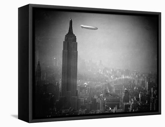 The Zeppelin Hindenburg Floats Past the Empire State Building-null-Framed Premier Image Canvas