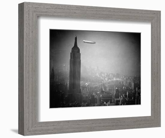 The Zeppelin Hindenburg Floats Past the Empire State Building-null-Framed Photographic Print