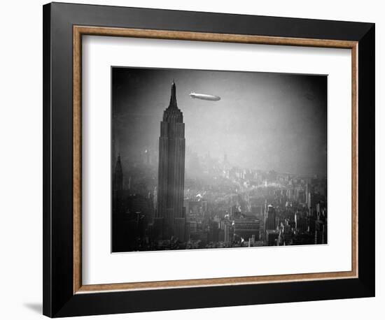 The Zeppelin Hindenburg Floats Past the Empire State Building-null-Framed Photographic Print