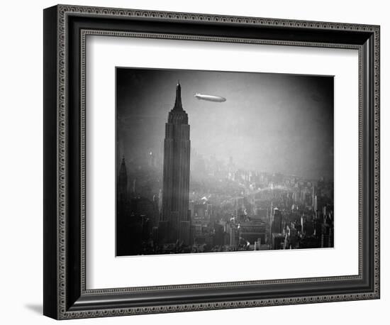 The Zeppelin Hindenburg Floats Past the Empire State Building-null-Framed Photographic Print