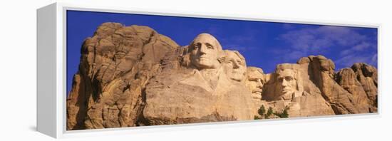 This Is a Close Up View of Mount Rushmore National Monument Against a Blue Sky-null-Framed Stretched Canvas