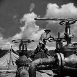 Worker Opening up a Pipeline to Let the Oil Flow-Thomas D^ Mcavoy-Photographic Print