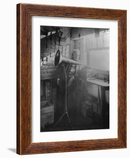 Thomas Edison Listening To The Phonograph-null-Framed Art Print