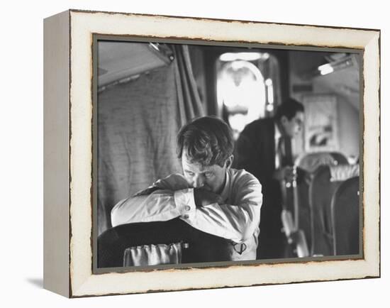 Thoughtful Senator Robert F. Kennedy on Airplane During Campaign Trip to Aid Local Candidates-Bill Eppridge-Framed Premier Image Canvas