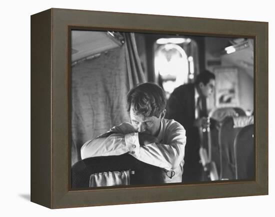 Thoughtful Senator Robert F. Kennedy on Airplane During Campaign Trip to Aid Local Candidates-Bill Eppridge-Framed Premier Image Canvas