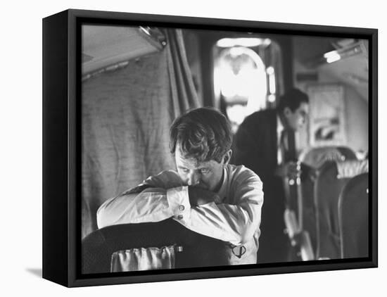 Thoughtful Senator Robert F. Kennedy on Airplane During Campaign Trip to Aid Local Candidates-Bill Eppridge-Framed Premier Image Canvas