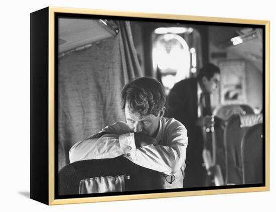 Thoughtful Senator Robert F. Kennedy on Airplane During Campaign Trip to Aid Local Candidates-Bill Eppridge-Framed Premier Image Canvas