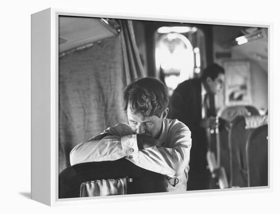 Thoughtful Senator Robert F. Kennedy on Airplane During Campaign Trip to Aid Local Candidates-Bill Eppridge-Framed Premier Image Canvas