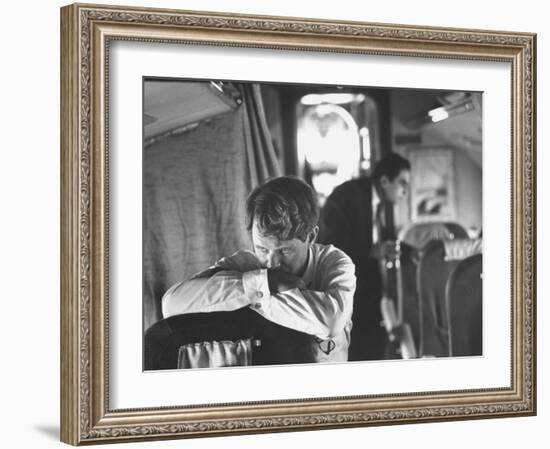 Thoughtful Senator Robert F. Kennedy on Airplane During Campaign Trip to Aid Local Candidates-Bill Eppridge-Framed Photographic Print