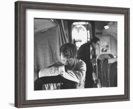 Thoughtful Senator Robert F. Kennedy on Airplane During Campaign Trip to Aid Local Candidates-Bill Eppridge-Framed Photographic Print