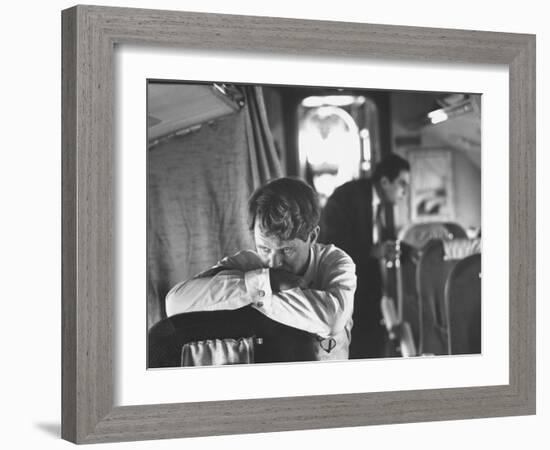 Thoughtful Senator Robert F. Kennedy on Airplane During Campaign Trip to Aid Local Candidates-Bill Eppridge-Framed Photographic Print