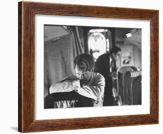 Thoughtful Senator Robert F. Kennedy on Airplane During Campaign Trip to Aid Local Candidates-Bill Eppridge-Framed Photographic Print