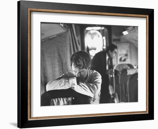 Thoughtful Senator Robert F. Kennedy on Airplane During Campaign Trip to Aid Local Candidates-Bill Eppridge-Framed Photographic Print