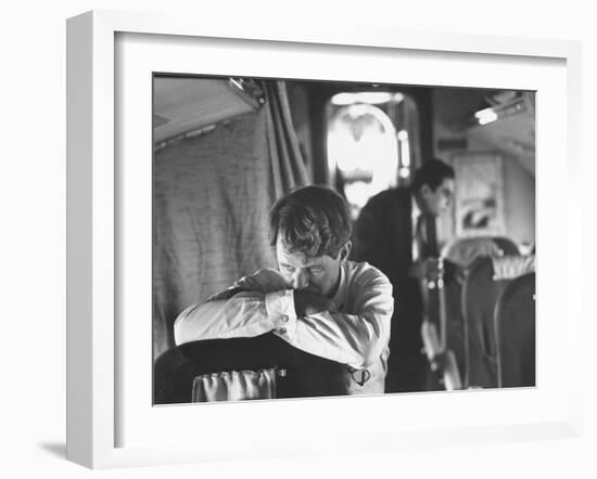 Thoughtful Senator Robert F. Kennedy on Airplane During Campaign Trip to Aid Local Candidates-Bill Eppridge-Framed Photographic Print