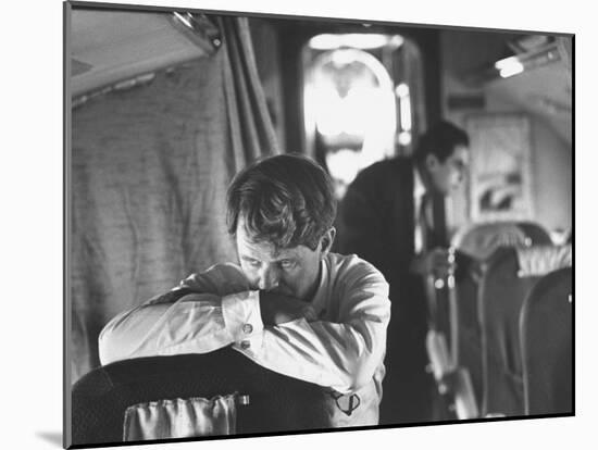 Thoughtful Senator Robert F. Kennedy on Airplane During Campaign Trip to Aid Local Candidates-Bill Eppridge-Mounted Photographic Print