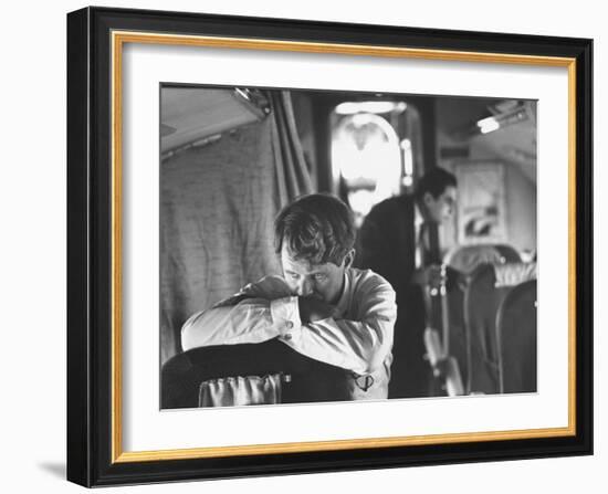 Thoughtful Senator Robert F. Kennedy on Airplane During Campaign Trip to Aid Local Candidates-Bill Eppridge-Framed Photographic Print