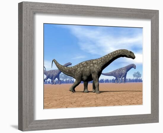 Three Argentinosaurus Dinosaurs Walking in the Desert-null-Framed Art Print