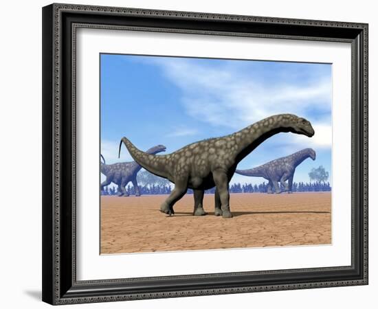 Three Argentinosaurus Dinosaurs Walking in the Desert-null-Framed Art Print