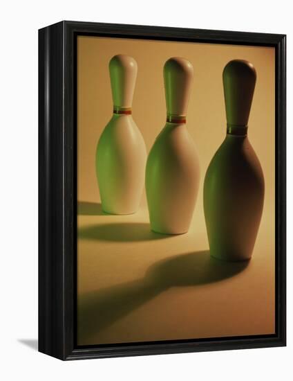 Three Bowling Pins in a Line-null-Framed Premier Image Canvas