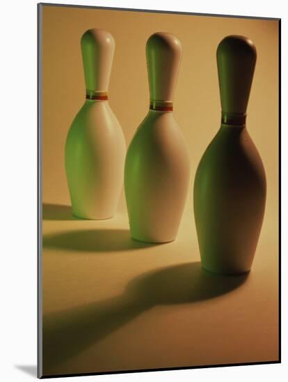 Three Bowling Pins in a Line-null-Mounted Photographic Print