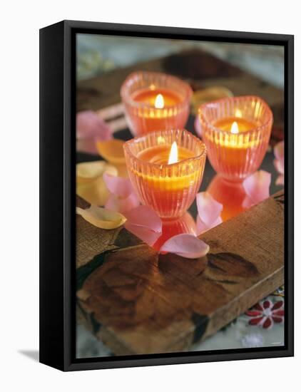 Three Candles and Rose Petals on a Table-Alena Hrbkova-Framed Premier Image Canvas