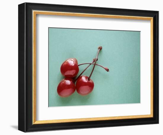 Three Cherries on a Green Background-Karen M^ Romanko-Framed Photographic Print