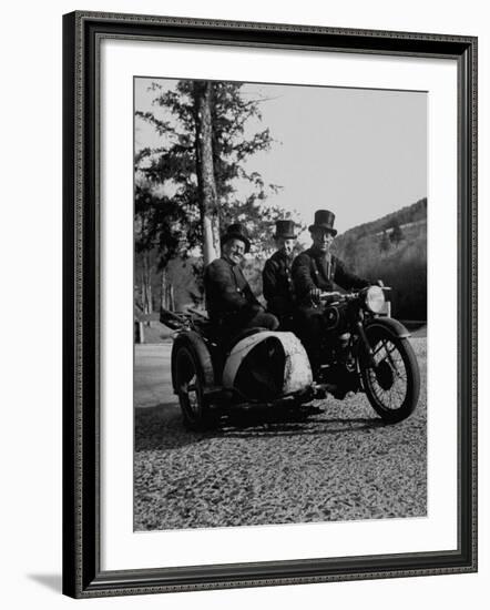 Three Chimney Sweeps Riding a Motorcycle-Dmitri Kessel-Framed Photographic Print