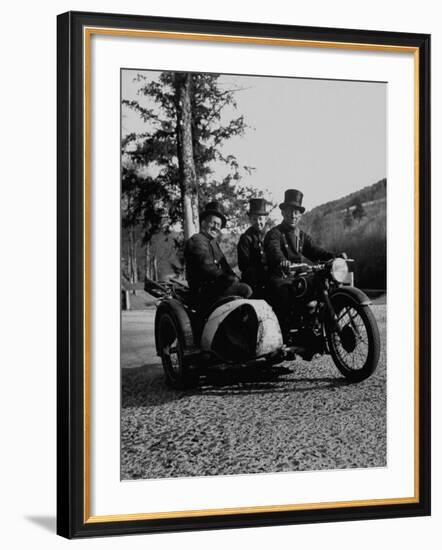 Three Chimney Sweeps Riding a Motorcycle-Dmitri Kessel-Framed Photographic Print