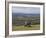 Three Girls Sitting on Bench Looking at View Over Bishops Cleeve Village, the Cotswolds, England-David Hughes-Framed Photographic Print