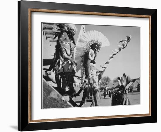 Three Indians In Headdress Watching Tourists "Dance San Ildefonso Pueblo New Mexico 1942." 1942-Ansel Adams-Framed Art Print