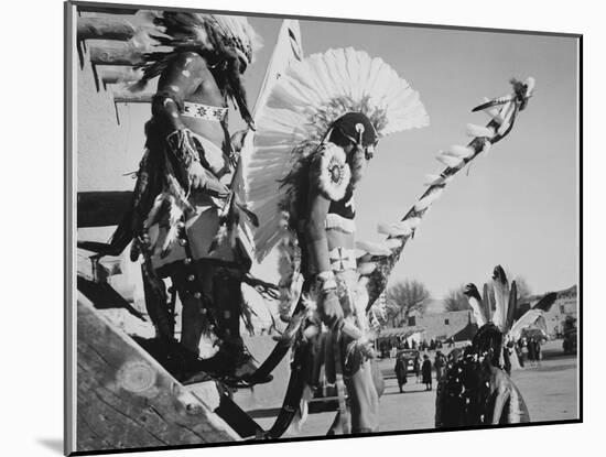 Three Indians In Headdress Watching Tourists "Dance San Ildefonso Pueblo New Mexico 1942." 1942-Ansel Adams-Mounted Art Print