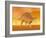 Three Kentrosaurus Dinosaurs in the Desert with Hazy Sunset Light-null-Framed Art Print