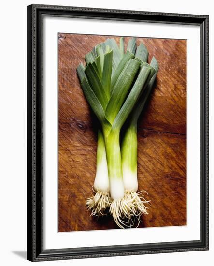 Three Leeks on Wooden Background-null-Framed Photographic Print