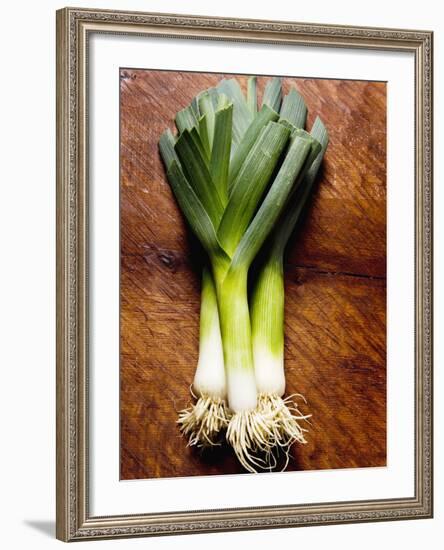 Three Leeks on Wooden Background-null-Framed Photographic Print