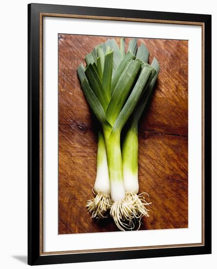 Three Leeks on Wooden Background-null-Framed Photographic Print