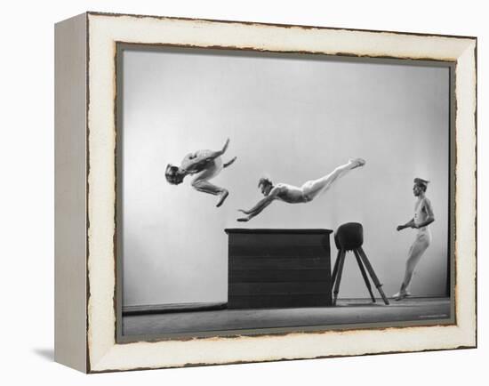 Three Men of Danish Gymnastic Team Performing a Tiger Leap-Gjon Mili-Framed Premier Image Canvas