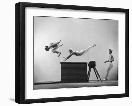 Three Men of Danish Gymnastic Team Performing a Tiger Leap-Gjon Mili-Framed Photographic Print